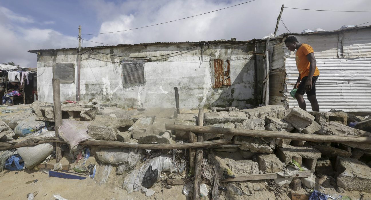 A Liberian man walks along a community built protection wall against sea erosion in West Point coastal slum community in Monrovia, Liberia October 23, 2021. EPA/AHMED JALLANZO